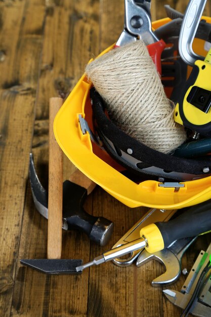 Construction equipment on wooden background