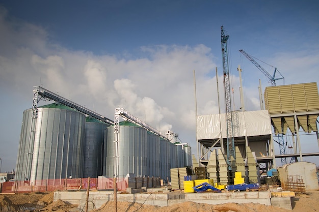 Construction of a feed mill agroprocessing plant for processing and silos for drying cleaning and storage of agricultural products flour cereals and grain