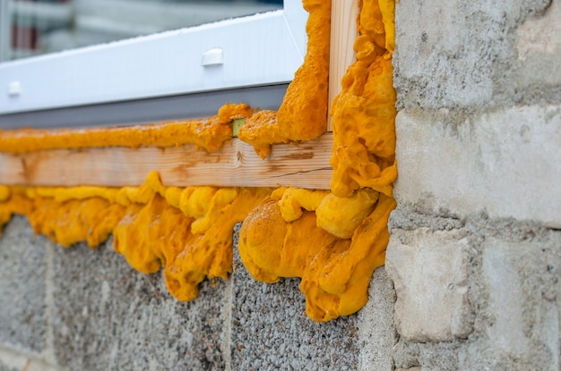 Construction foam. Foam of a stroiteln at a window. Dry foam at a window