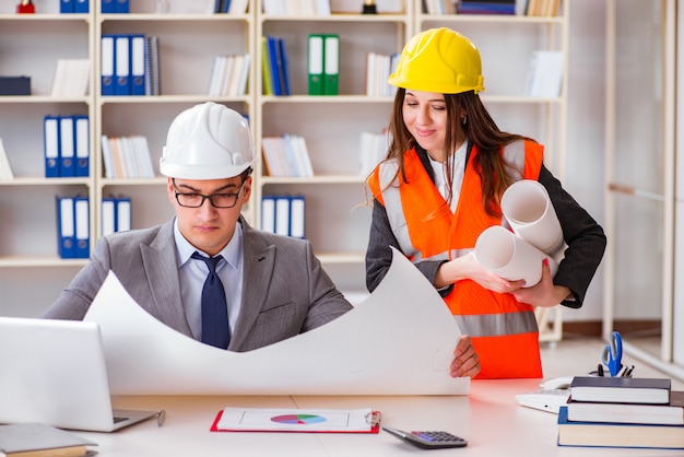 Construction foreman supervisor reviewing drawings