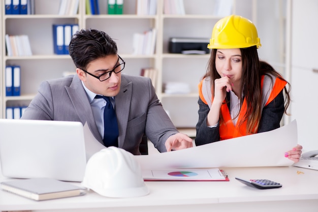 Construction foreman supervisor reviewing drawings