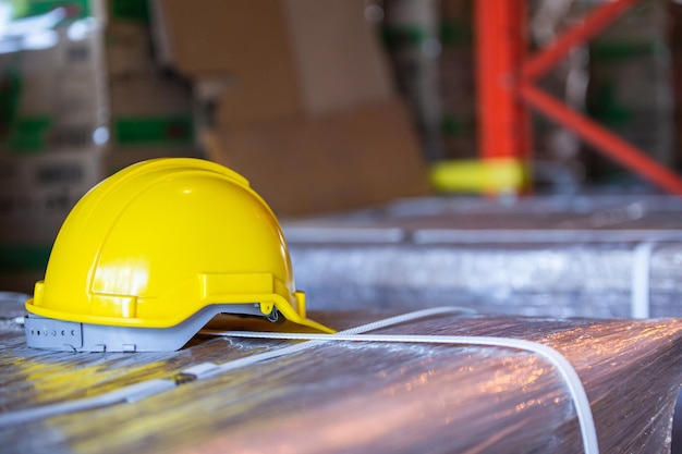 Construction hardhat or factory helmet at factory warehouse