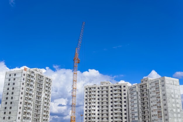 Construction of high-rise houses and building crane