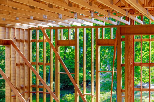 Construction home interior inside a framing on residential beam framework wooden new house