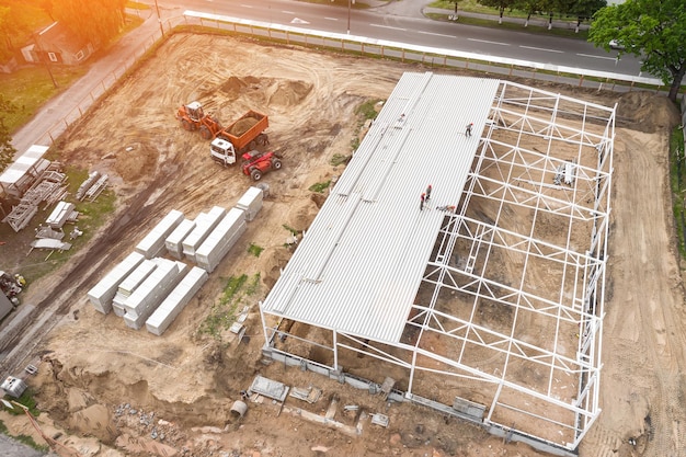 Construction of a modern frame building top view from a\
drone