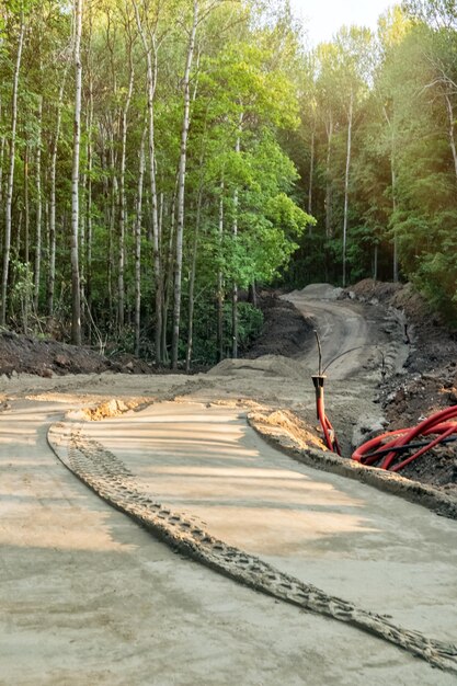 Construction of a modern ski-roller track on the forest slopes.