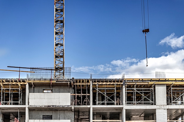 Construction of a monolithic reinforced concrete house. Modern building technologies. Construction of a modern multi-storey building.