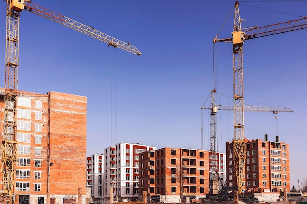 Construction of multistorey buildings with a tower cranes