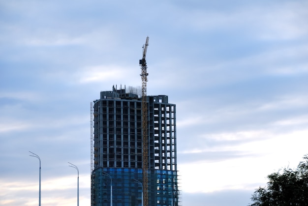 Construction of office building from glass and concrete.