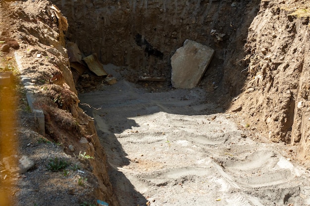 Construction pit in sand and cement close up