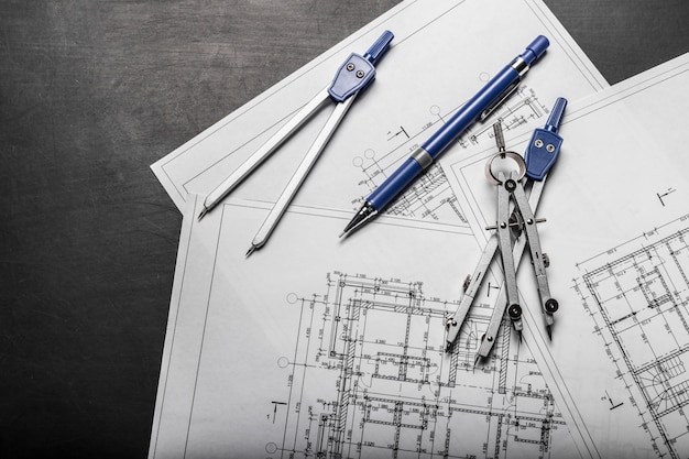 Construction planning drawings on black background