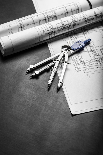 Construction planning drawings on black