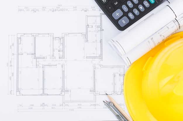 Construction planning with construction drawings and accessories, construction projects on paper 