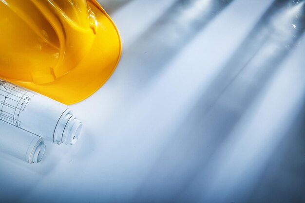 Construction plans building helmet on white background