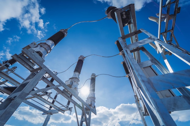 Construction of a power transmission substation on a background of blue sky