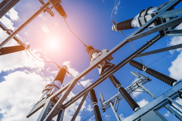 Construction of a power transmission substation on a background of blue sky