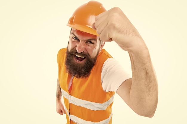 Construction power you can rely on Construction worker flex strong arm isolated on white Construction engineer or builder wear protective helmet and workwear Construction industry