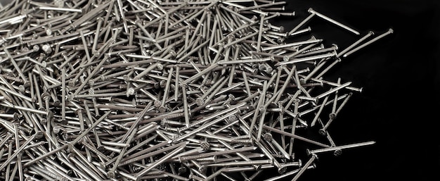 Construction repair tools Pile nails black background