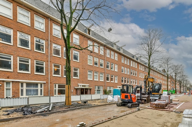 Construction at a residential building with the use of construction equipment