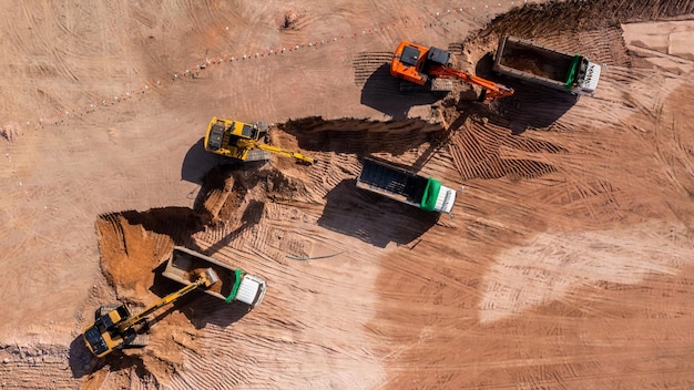 Construction site Aerial top view road roller and loader excavator tractor and soil grade car