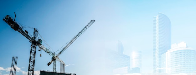 Foto sito di costruzione banner sfondo industria della costruzione e concetto aziendale gru su sfondo blu