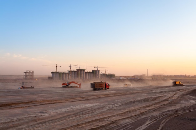 The construction site of coal washery dust was blowing at dusk