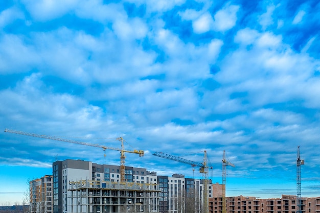 Construction site Highrise multistorey buildings under construction Tower cranes near buildings