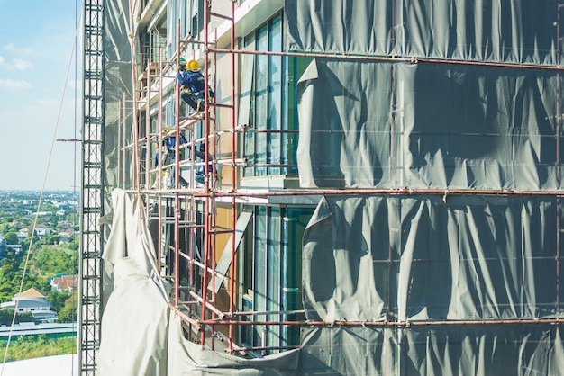 Construction site. Hoisting cranes and new multi-storey buildings.