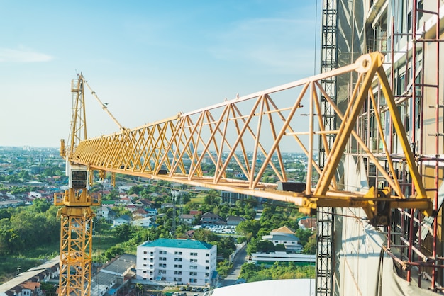 Construction site. Hoisting cranes and new multi-storey buildings.