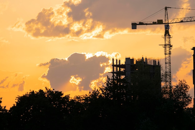 Construction site silhouette at sunset