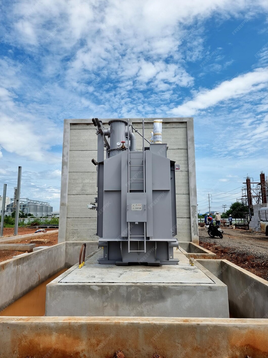 Premium Photo Construction of Substation Main tank power transformer