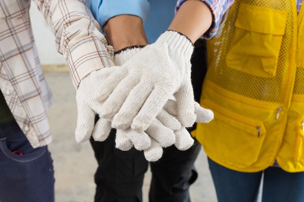 Photo construction team handshake or join hand of people