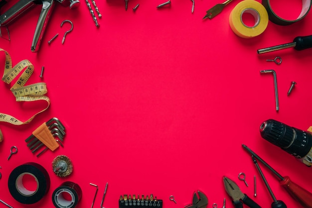 Photo construction tools on a pink background