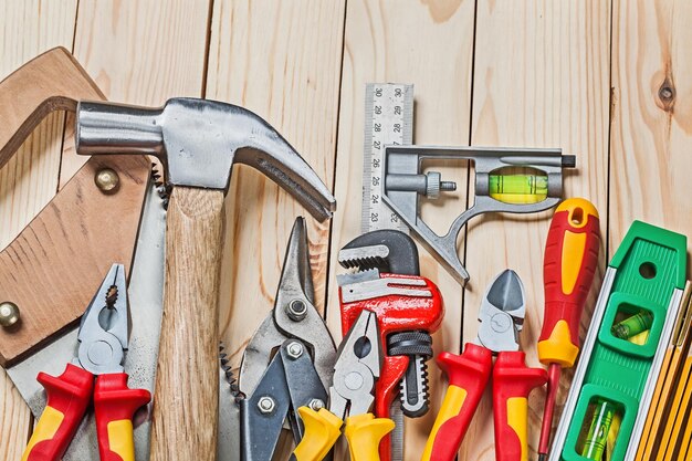 Construction tools set on wood boards close up view