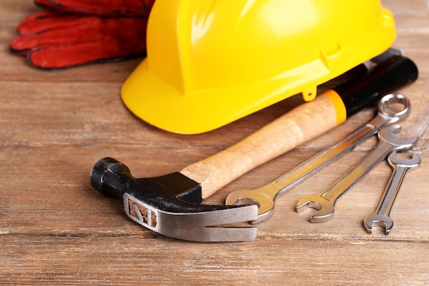 Photo construction tools with helmet on table close up