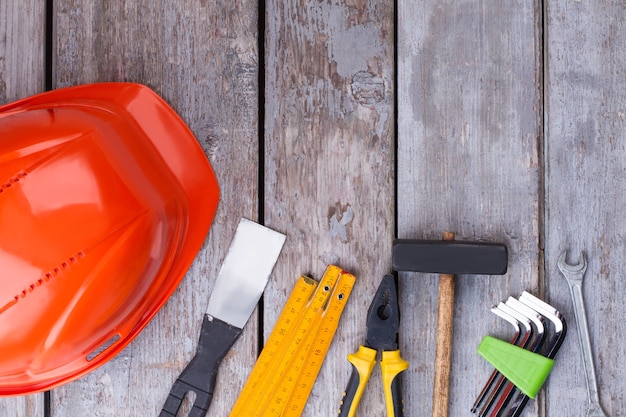 Construction tools on wooden background