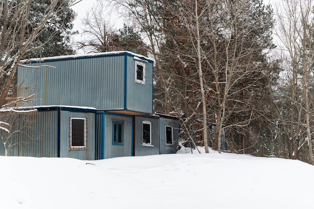 Construction trailer with windows on snowcovered site shift housing