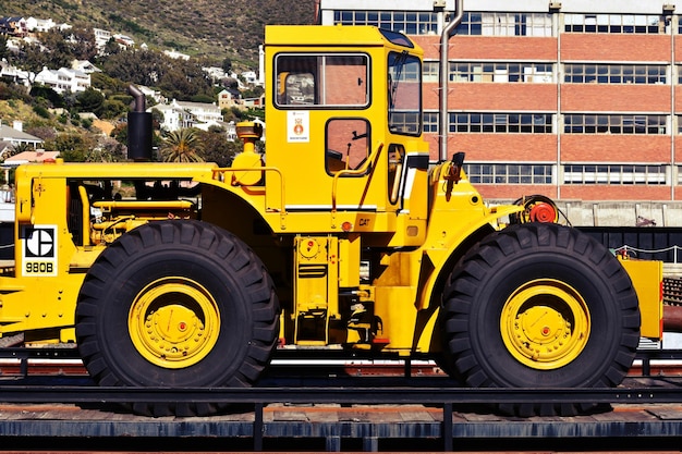 Construction vehicle against building