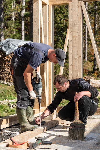 Construction of a wooden cabin in a remote forest area