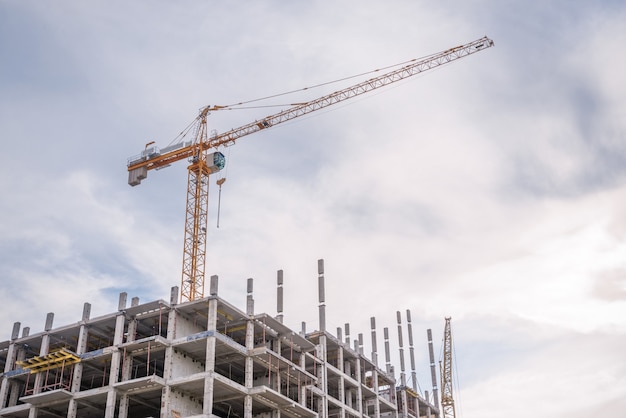 Construction work site and high-rise crane