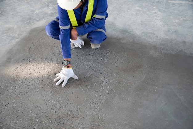 a construction worker check quality epoxy floor in warehouse factory japan construction si