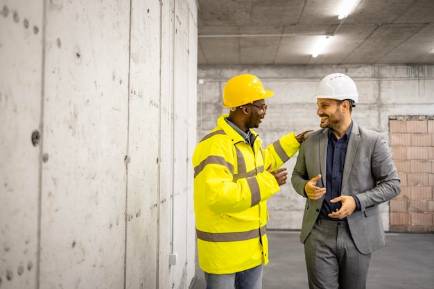 Construction worker and contractor working together on the new building project