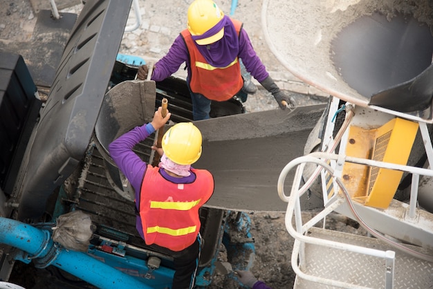 Construction worker pouring concrete