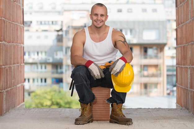 Construction Worker Relaxing The Fresh Air During Work