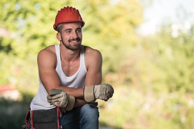 Construction Worker Relaxing The Fresh Air During Work