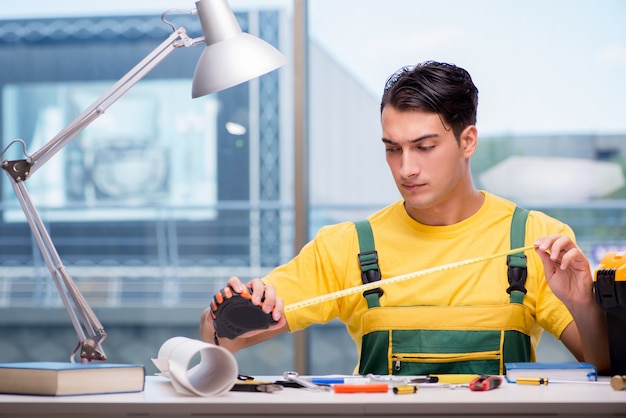 Construction worker sitting at the desk