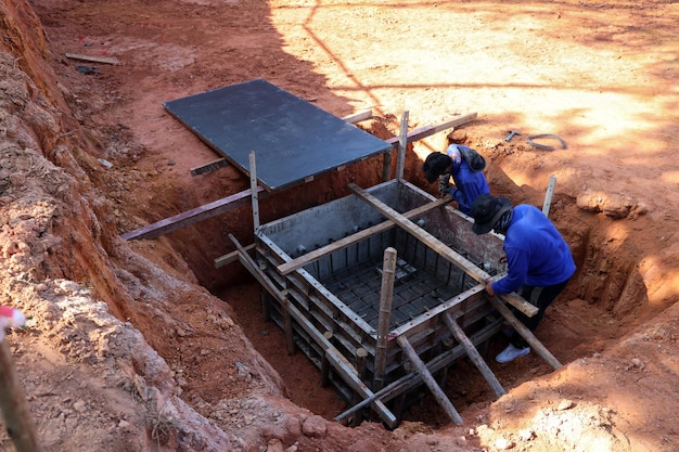 Construction worker steel fixer working at the building site