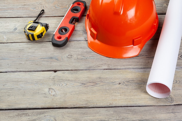 Construction  worker supplies and instruments on wooden