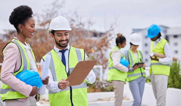 Construction worker team discussion and clipboard for planning vision strategy and blueprint for property Architect group black woman and men with tablet helmet and conversation for development