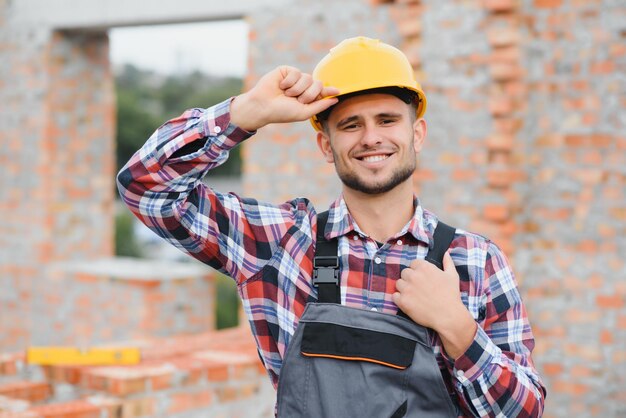 Construction worker in uniform and safety equipment have job on building Industrial theme